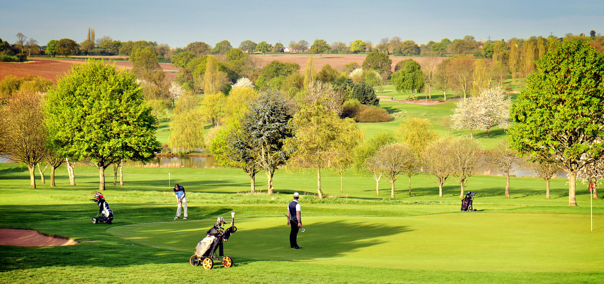 A picture of the golf course at the Windmill Village hotel on a sunny day
